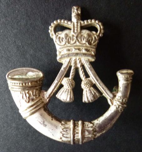 The Rifles cap badge.