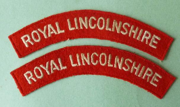Pair of 'Royal Lincolnshire' Regiment machine-embroidered cloth shoulder-titles.