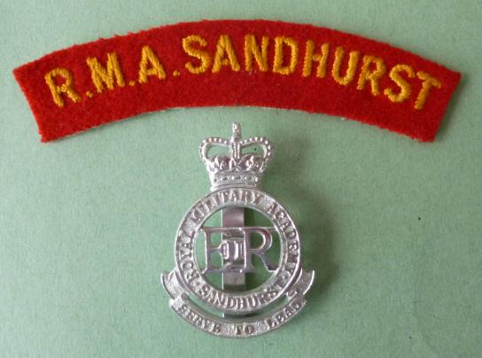 Royal Military Academy Sandhurst cap-badge (EiiR / Queen's crown) with machine-embroidered 'R.M.A.Sandhurst' shoulder-title.