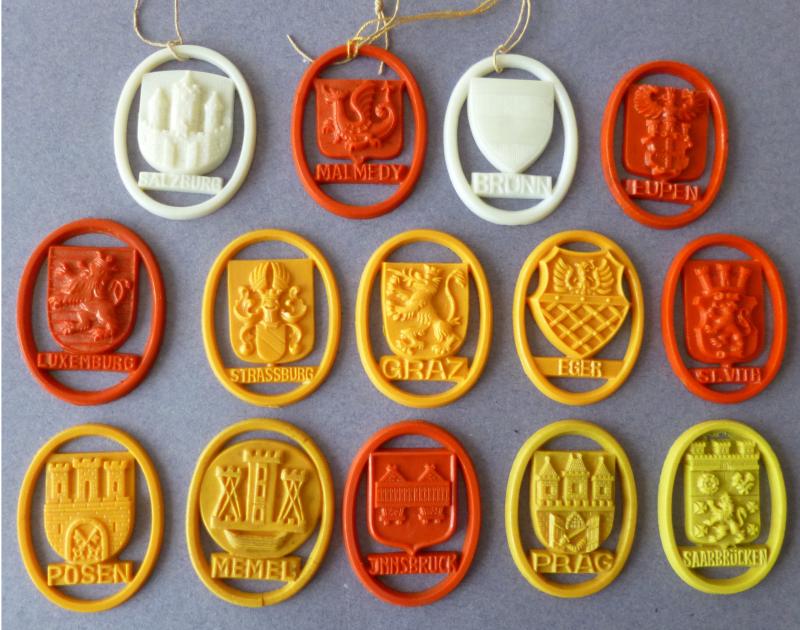 Third Reich : Collection of 14 Plastic WHW City Arms Pendants.